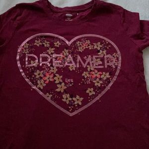 A pink and red heart tee shirt with flowers.